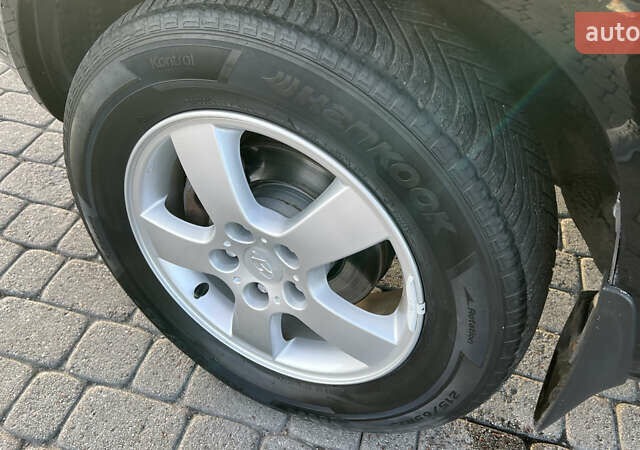 Черный Хендай Туксон, объемом двигателя 1.98 л и пробегом 243 тыс. км за 8500 $, фото 21 на Automoto.ua