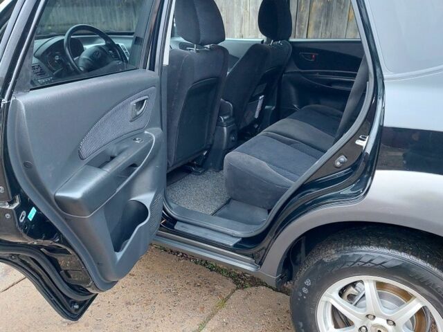 Черный Хендай Туксон, объемом двигателя 2 л и пробегом 272 тыс. км за 7500 $, фото 10 на Automoto.ua