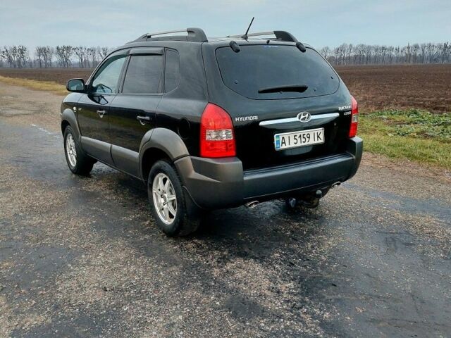Черный Хендай Туксон, объемом двигателя 2 л и пробегом 272 тыс. км за 7500 $, фото 18 на Automoto.ua