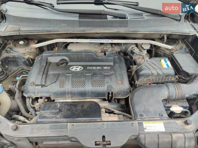 Черный Хендай Туксон, объемом двигателя 2 л и пробегом 270 тыс. км за 6800 $, фото 18 на Automoto.ua