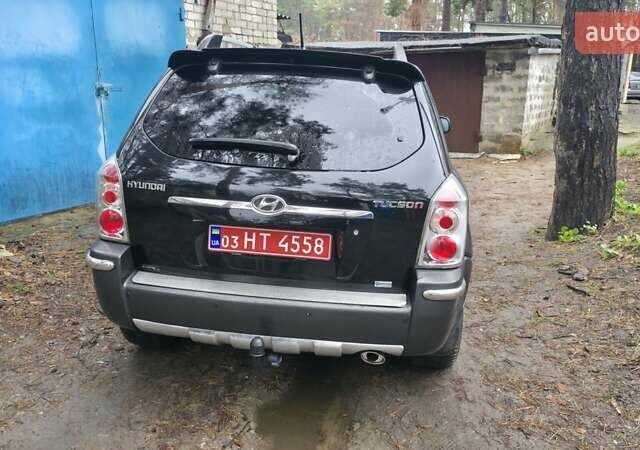 Чорний Хендай Туксон, об'ємом двигуна 2 л та пробігом 207 тис. км за 8200 $, фото 4 на Automoto.ua
