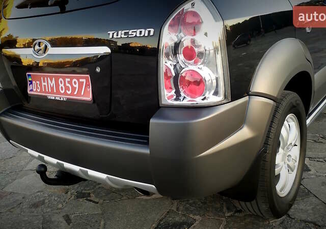Черный Хендай Туксон, объемом двигателя 2 л и пробегом 230 тыс. км за 8600 $, фото 70 на Automoto.ua
