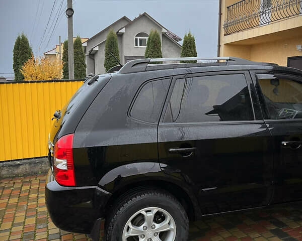 Черный Хендай Туксон, объемом двигателя 2 л и пробегом 151 тыс. км за 9100 $, фото 6 на Automoto.ua
