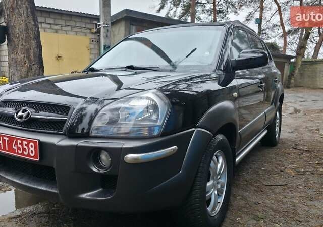 Чорний Хендай Туксон, об'ємом двигуна 2 л та пробігом 207 тис. км за 8200 $, фото 1 на Automoto.ua