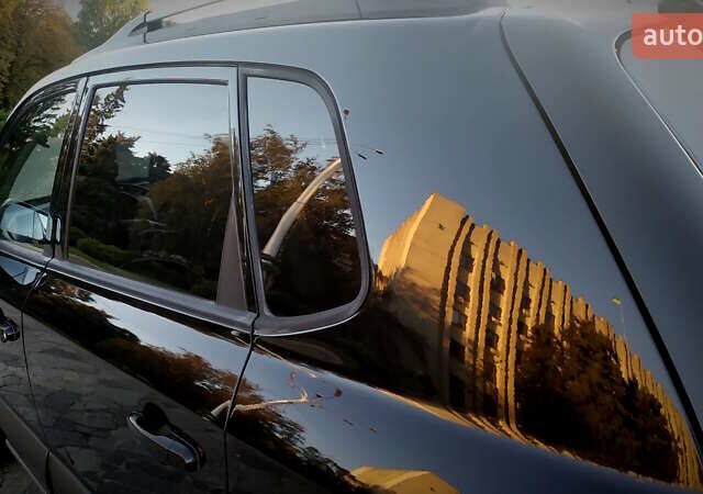 Черный Хендай Туксон, объемом двигателя 2 л и пробегом 230 тыс. км за 8600 $, фото 78 на Automoto.ua