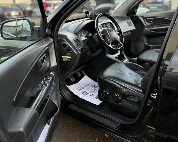 Черный Хендай Туксон, объемом двигателя 1.98 л и пробегом 230 тыс. км за 7750 $, фото 8 на Automoto.ua