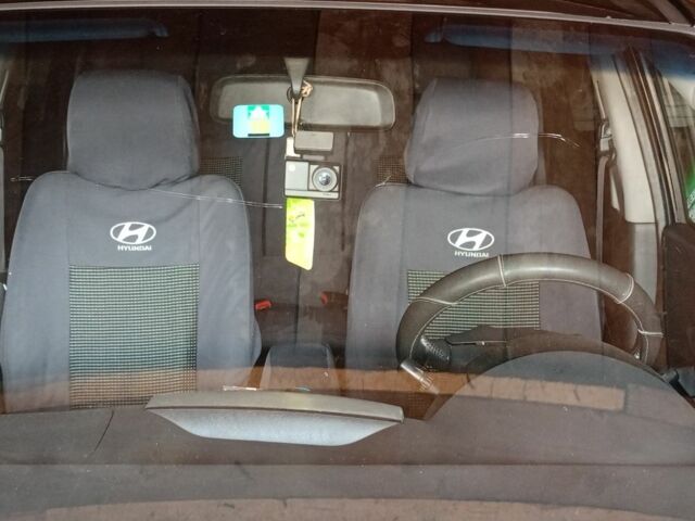 Черный Хендай Туксон, объемом двигателя 2 л и пробегом 240 тыс. км за 8800 $, фото 4 на Automoto.ua