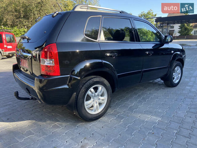 Черный Хендай Туксон, объемом двигателя 1.98 л и пробегом 197 тыс. км за 8000 $, фото 4 на Automoto.ua