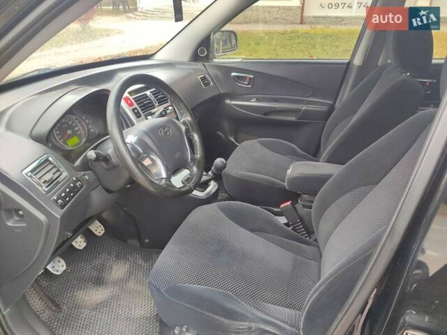 Черный Хендай Туксон, объемом двигателя 2 л и пробегом 270 тыс. км за 6800 $, фото 12 на Automoto.ua