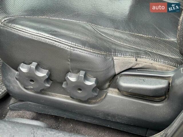 Черный Хендай Туксон, объемом двигателя 2 л и пробегом 177 тыс. км за 8940 $, фото 15 на Automoto.ua