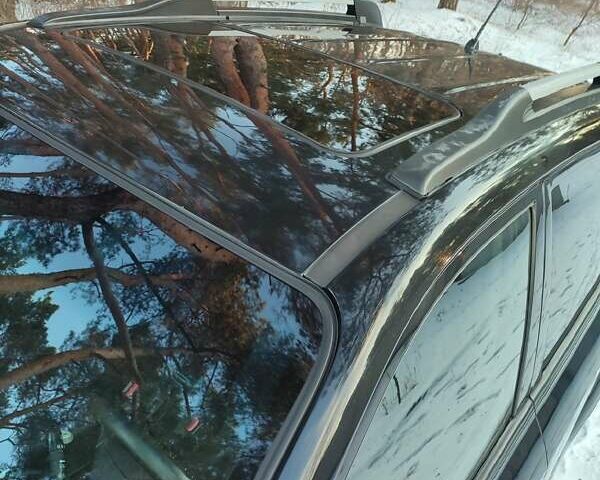 Черный Хендай Туксон, объемом двигателя 1.98 л и пробегом 335 тыс. км за 7800 $, фото 15 на Automoto.ua