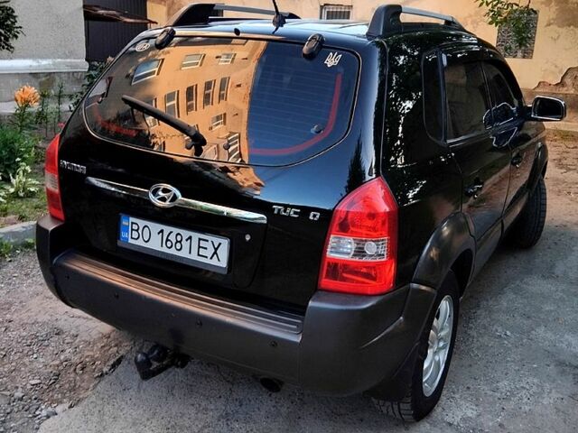 Черный Хендай Туксон, объемом двигателя 2 л и пробегом 270 тыс. км за 7400 $, фото 5 на Automoto.ua