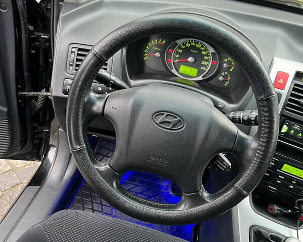 Чорний Хендай Туксон, об'ємом двигуна 1.98 л та пробігом 155 тис. км за 8750 $, фото 10 на Automoto.ua