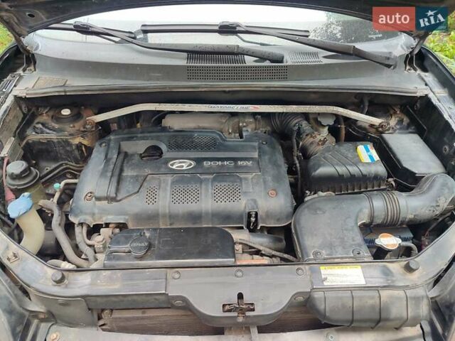 Черный Хендай Туксон, объемом двигателя 2 л и пробегом 280 тыс. км за 6700 $, фото 18 на Automoto.ua