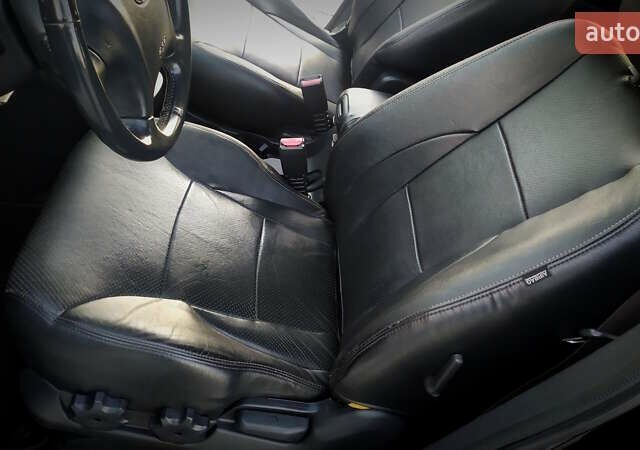 Черный Хендай Туксон, объемом двигателя 2 л и пробегом 230 тыс. км за 8600 $, фото 145 на Automoto.ua