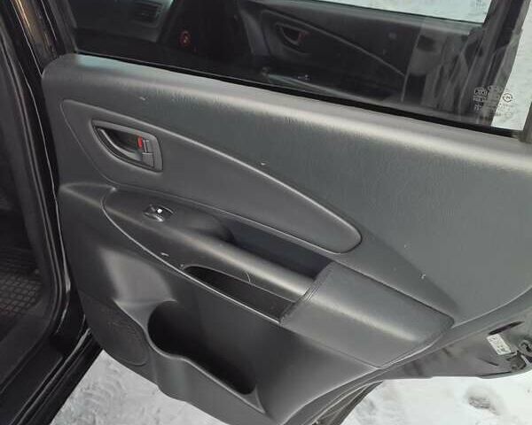 Черный Хендай Туксон, объемом двигателя 1.98 л и пробегом 335 тыс. км за 7800 $, фото 8 на Automoto.ua