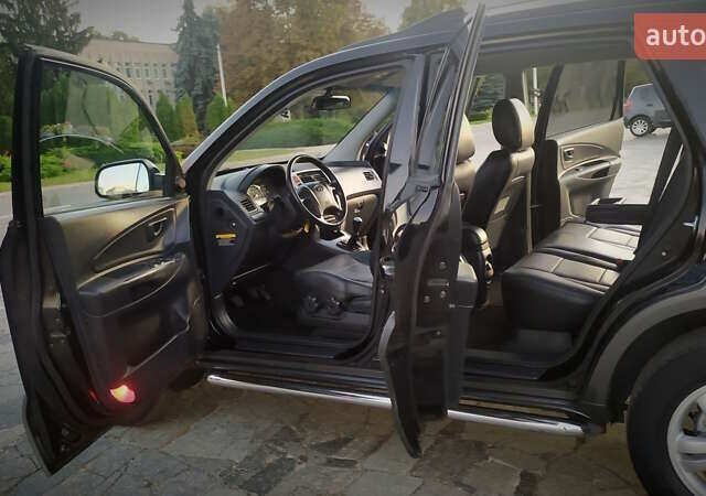Черный Хендай Туксон, объемом двигателя 2 л и пробегом 230 тыс. км за 8600 $, фото 196 на Automoto.ua
