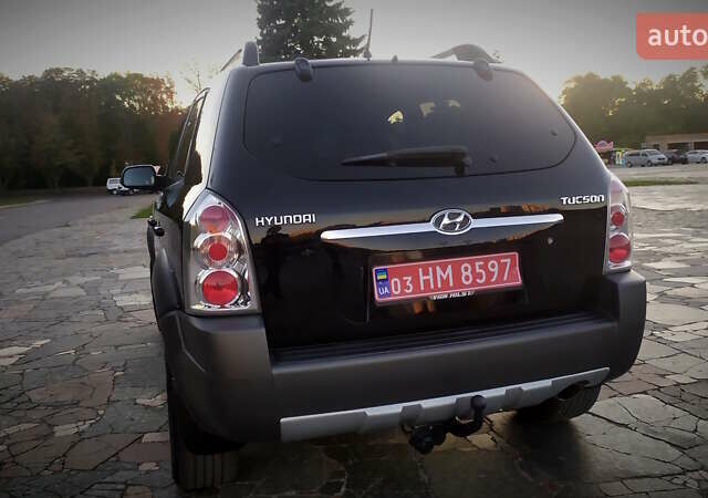 Черный Хендай Туксон, объемом двигателя 2 л и пробегом 230 тыс. км за 8600 $, фото 107 на Automoto.ua