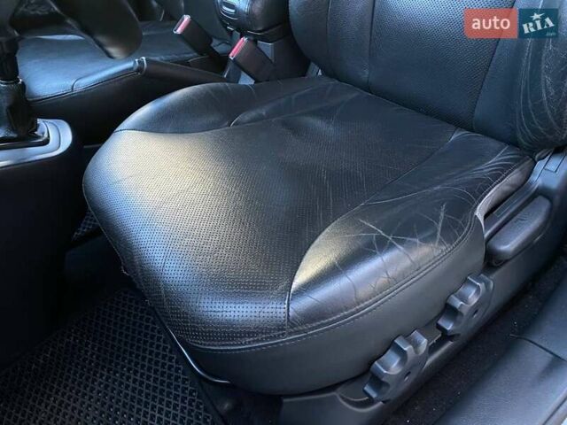 Черный Хендай Туксон, объемом двигателя 1.98 л и пробегом 286 тыс. км за 7300 $, фото 30 на Automoto.ua