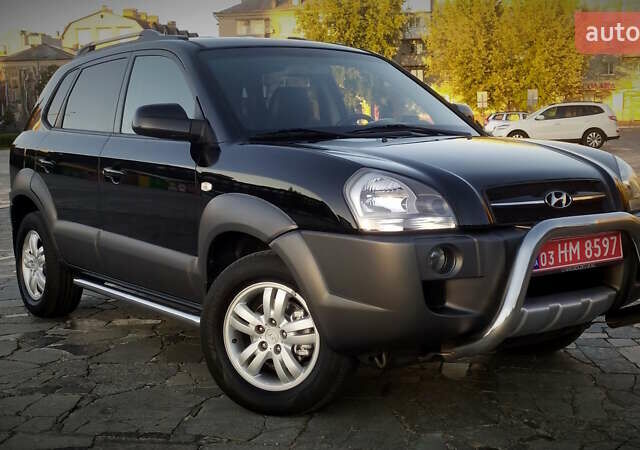 Черный Хендай Туксон, объемом двигателя 2 л и пробегом 230 тыс. км за 8600 $, фото 27 на Automoto.ua