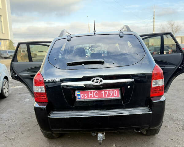 Черный Хендай Туксон, объемом двигателя 1.98 л и пробегом 230 тыс. км за 7750 $, фото 10 на Automoto.ua