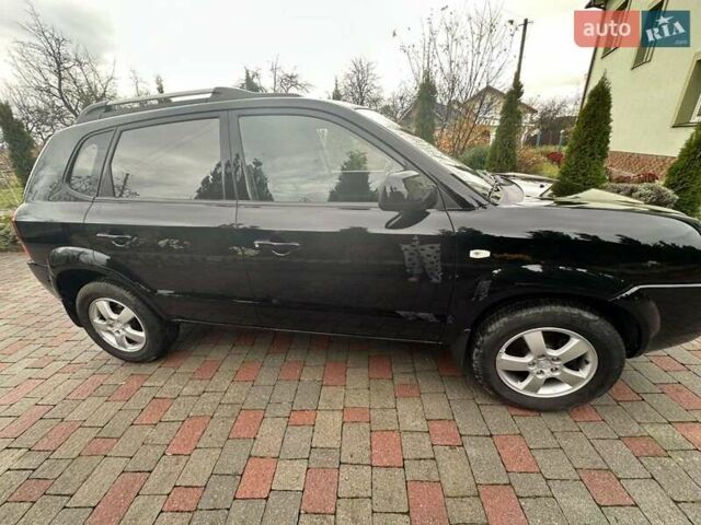 Черный Хендай Туксон, объемом двигателя 2 л и пробегом 218 тыс. км за 7600 $, фото 7 на Automoto.ua