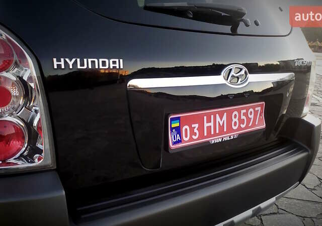 Черный Хендай Туксон, объемом двигателя 2 л и пробегом 230 тыс. км за 8600 $, фото 74 на Automoto.ua