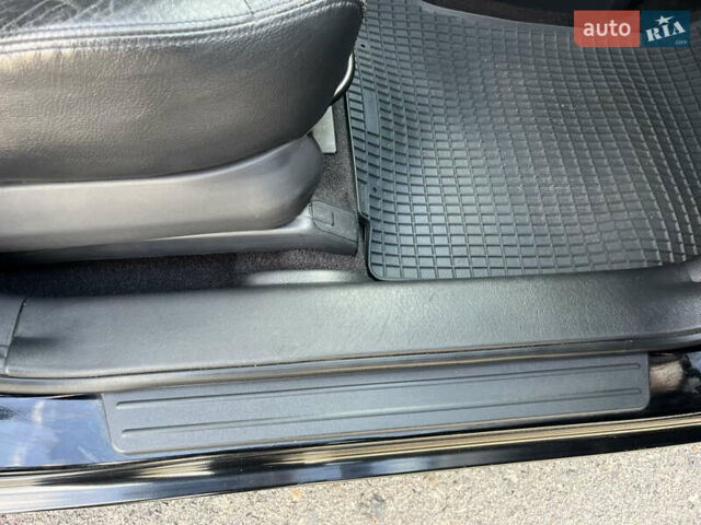 Черный Хендай Туксон, объемом двигателя 2 л и пробегом 256 тыс. км за 7800 $, фото 14 на Automoto.ua