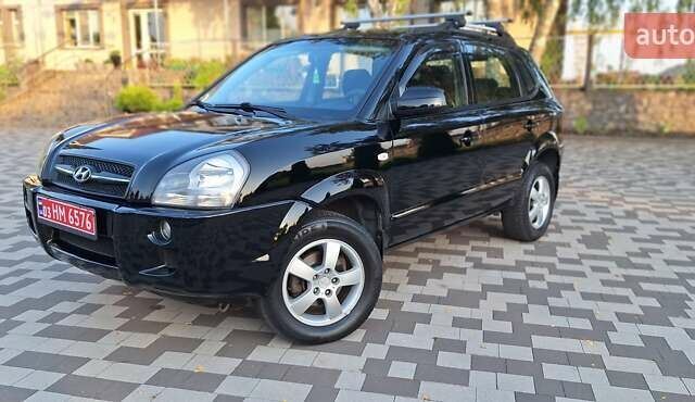 Черный Хендай Туксон, объемом двигателя 2 л и пробегом 190 тыс. км за 8150 $, фото 18 на Automoto.ua