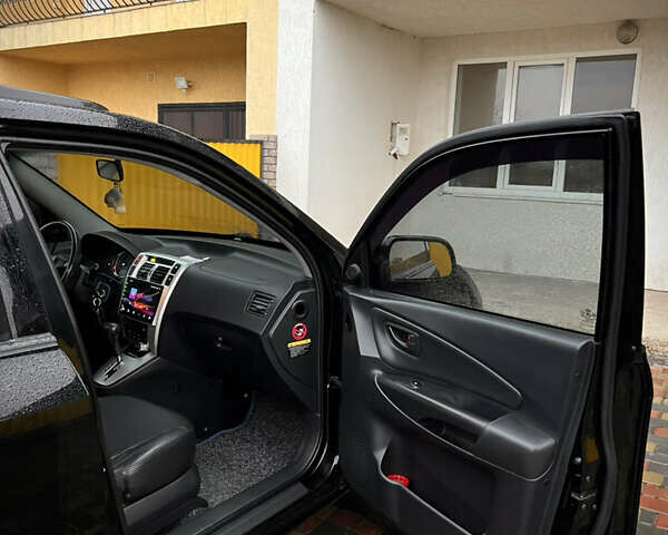 Черный Хендай Туксон, объемом двигателя 2 л и пробегом 151 тыс. км за 9100 $, фото 20 на Automoto.ua