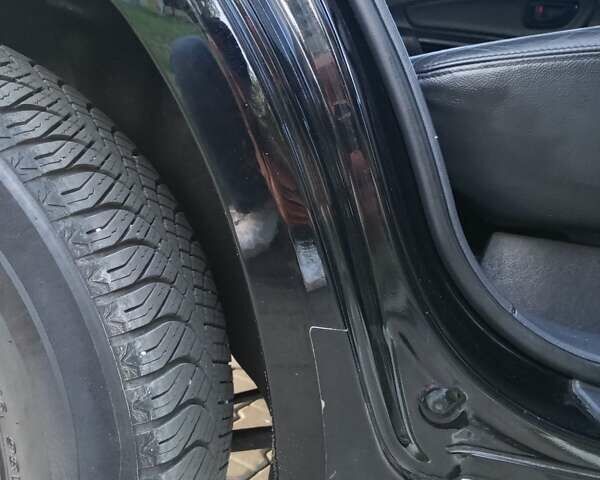 Чорний Хендай Туксон, об'ємом двигуна 1.98 л та пробігом 192 тис. км за 7950 $, фото 24 на Automoto.ua