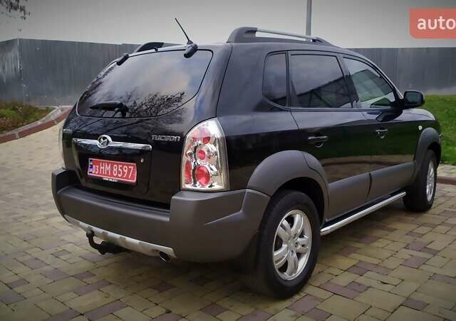 Чорний Хендай Туксон, об'ємом двигуна 2 л та пробігом 229 тис. км за 8600 $, фото 43 на Automoto.ua