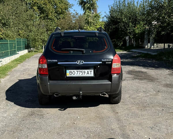 Черный Хендай Туксон, объемом двигателя 2 л и пробегом 294 тыс. км за 7500 $, фото 4 на Automoto.ua