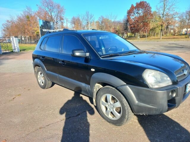 Черный Хендай Туксон, объемом двигателя 2 л и пробегом 227 тыс. км за 7300 $, фото 1 на Automoto.ua