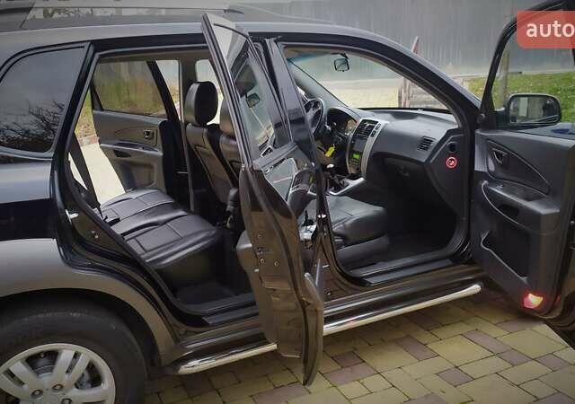 Чорний Хендай Туксон, об'ємом двигуна 2 л та пробігом 229 тис. км за 8600 $, фото 100 на Automoto.ua