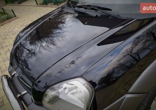 Чорний Хендай Туксон, об'ємом двигуна 2 л та пробігом 229 тис. км за 8600 $, фото 55 на Automoto.ua