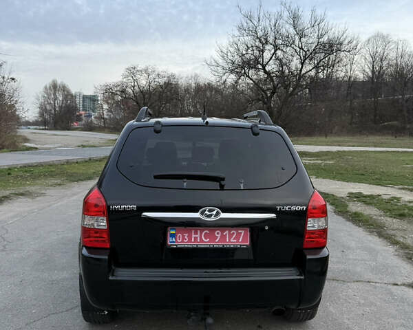 Черный Хендай Туксон, объемом двигателя 1.98 л и пробегом 159 тыс. км за 7600 $, фото 12 на Automoto.ua