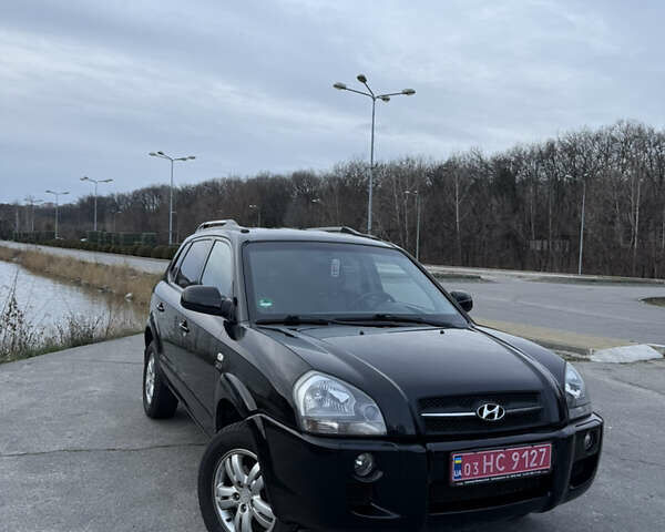 Черный Хендай Туксон, объемом двигателя 1.98 л и пробегом 159 тыс. км за 7600 $, фото 4 на Automoto.ua