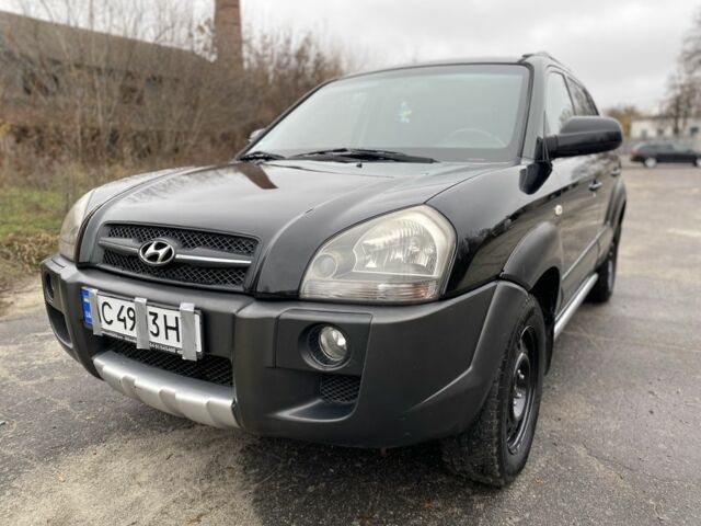 Черный Хендай Туксон, объемом двигателя 2 л и пробегом 330 тыс. км за 4350 $, фото 2 на Automoto.ua