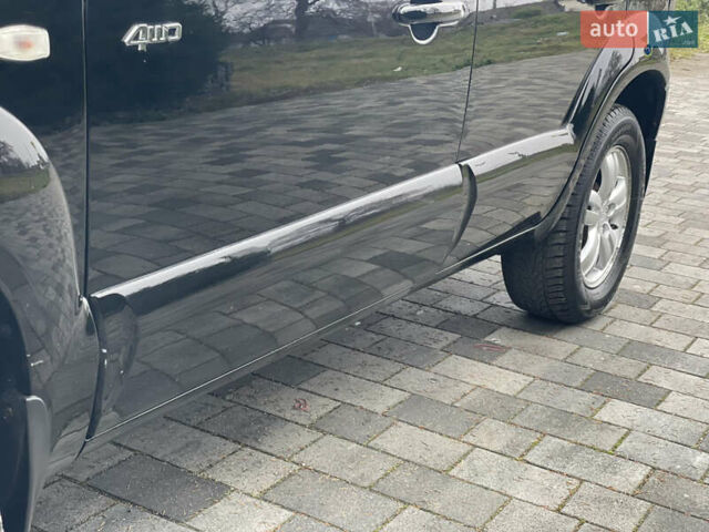 Черный Хендай Туксон, объемом двигателя 2 л и пробегом 180 тыс. км за 7700 $, фото 20 на Automoto.ua