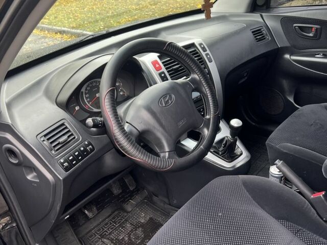 Хендай Туксон 2007 у Кам'янське (Дніпродзержинськ) на Automoto.ua Чорний Хендай Туксон, об'ємом двигуна 2 л та пробігом 162 тис. км за 7999 $, фото 7 на Automoto.ua