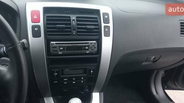 Черный Хендай Туксон, объемом двигателя 1.98 л и пробегом 155 тыс. км за 7999 $, фото 32 на Automoto.ua