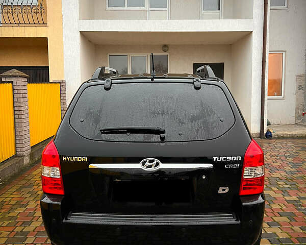 Черный Хендай Туксон, объемом двигателя 2 л и пробегом 151 тыс. км за 9100 $, фото 38 на Automoto.ua