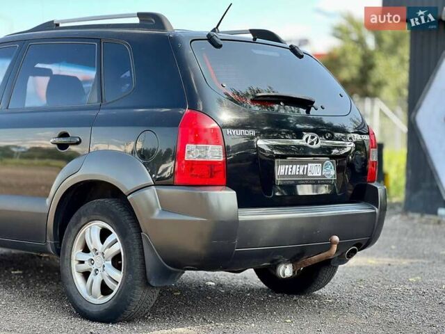 Черный Хендай Туксон, объемом двигателя 2 л и пробегом 227 тыс. км за 8200 $, фото 11 на Automoto.ua