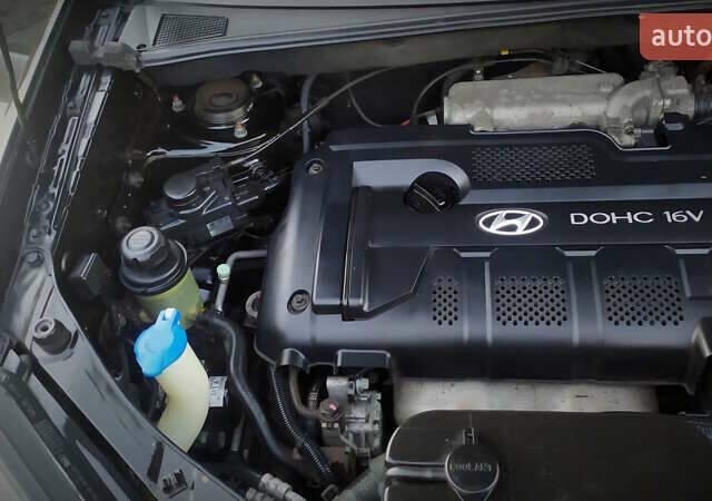 Черный Хендай Туксон, объемом двигателя 2 л и пробегом 230 тыс. км за 8600 $, фото 203 на Automoto.ua