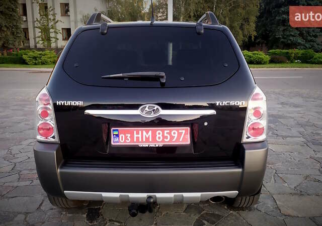 Черный Хендай Туксон, объемом двигателя 2 л и пробегом 230 тыс. км за 8600 $, фото 118 на Automoto.ua