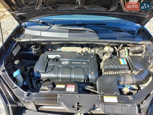 Черный Хендай Туксон, объемом двигателя 2 л и пробегом 219 тыс. км за 8500 $, фото 15 на Automoto.ua