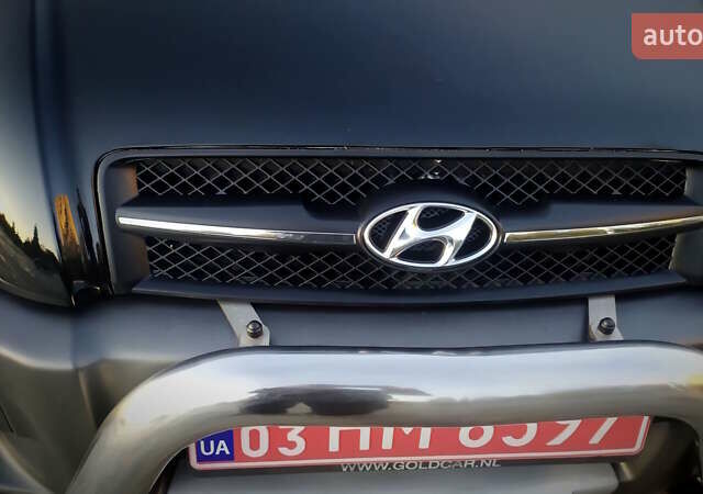Черный Хендай Туксон, объемом двигателя 2 л и пробегом 230 тыс. км за 8600 $, фото 48 на Automoto.ua