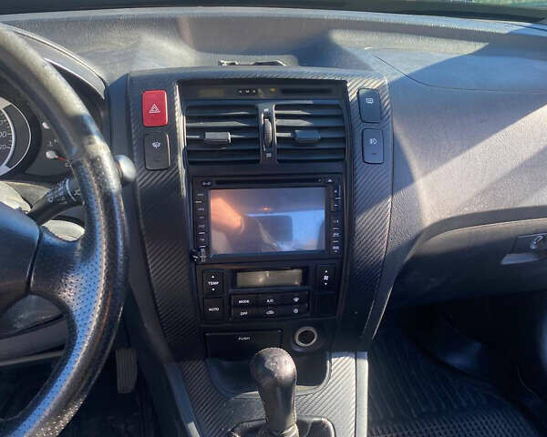 Чорний Хендай Туксон, об'ємом двигуна 1.98 л та пробігом 215 тис. км за 7540 $, фото 6 на Automoto.ua