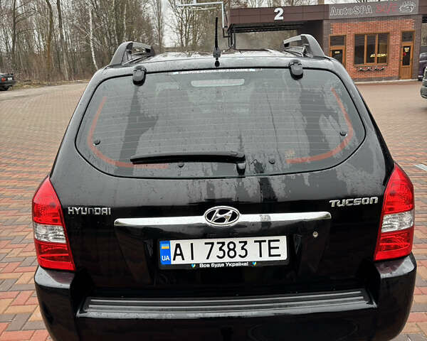 Черный Хендай Туксон, объемом двигателя 2 л и пробегом 225 тыс. км за 8600 $, фото 7 на Automoto.ua